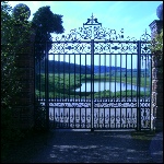 Decorative double gates including ornimental roses and robin