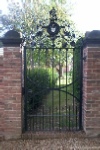 Single pedestrian gate with family crest detail